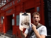 Standing in front of America's first pizzeria